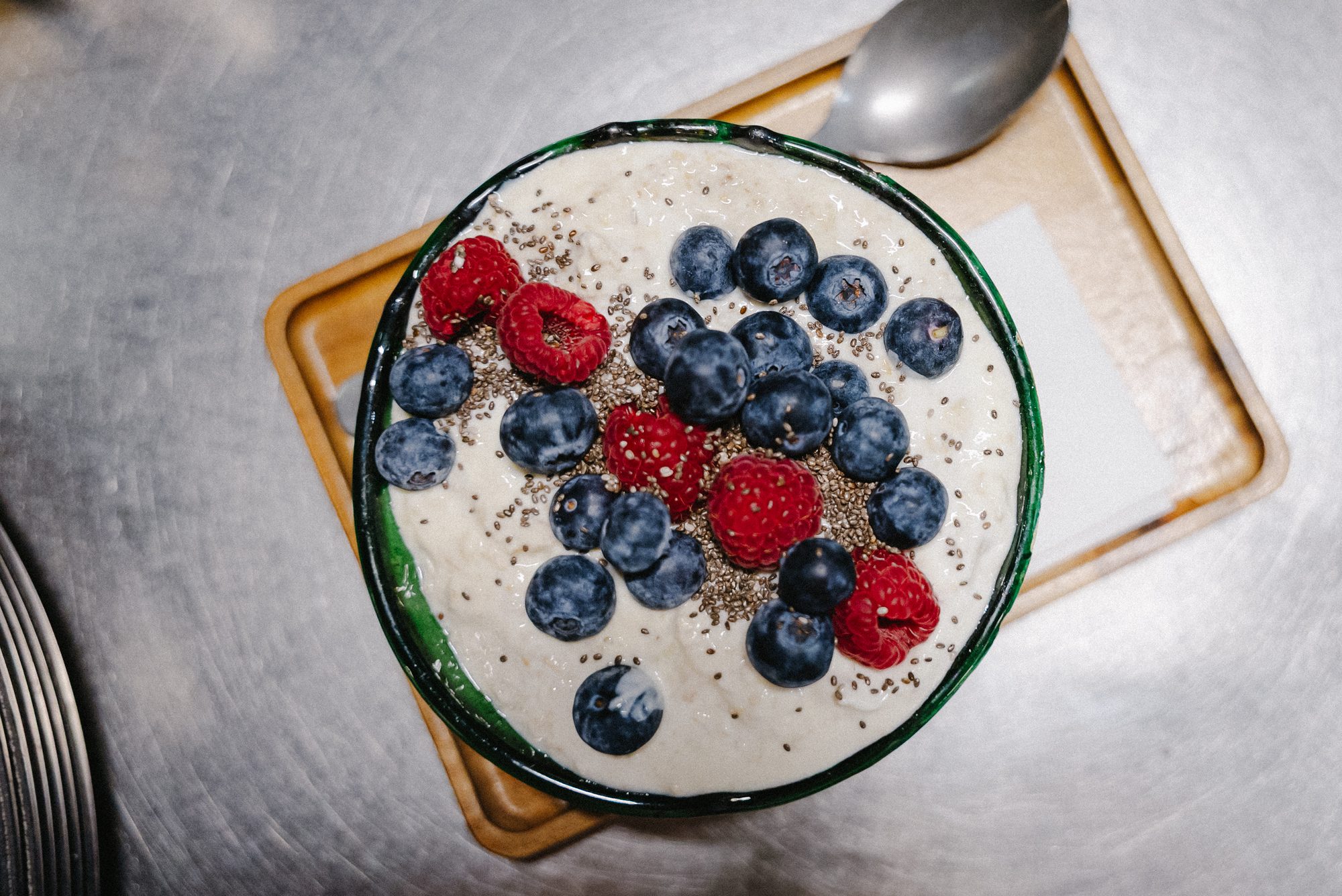 Yoghurt bowl with fresh berries and chia — top down.