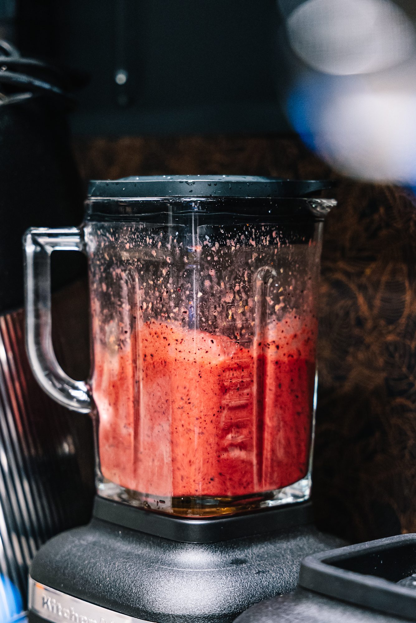 Red-fruit smoothie whirring in the blender.