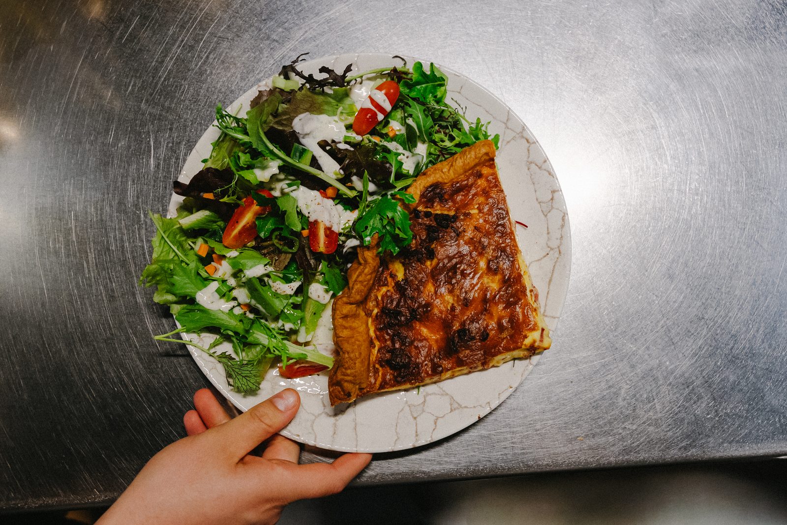 Quiche of the day with a fresh side salad.